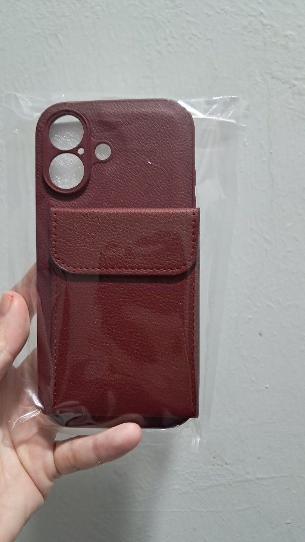 Iphone Cover (Category: Cases & Covers) located in Puchong. Submitted by gr33n_apple (Listing ID 1441336310, Image 1). Description: - Stylish maroon iPhone cover - Faux leather material - Features a convenient card slot on the back .