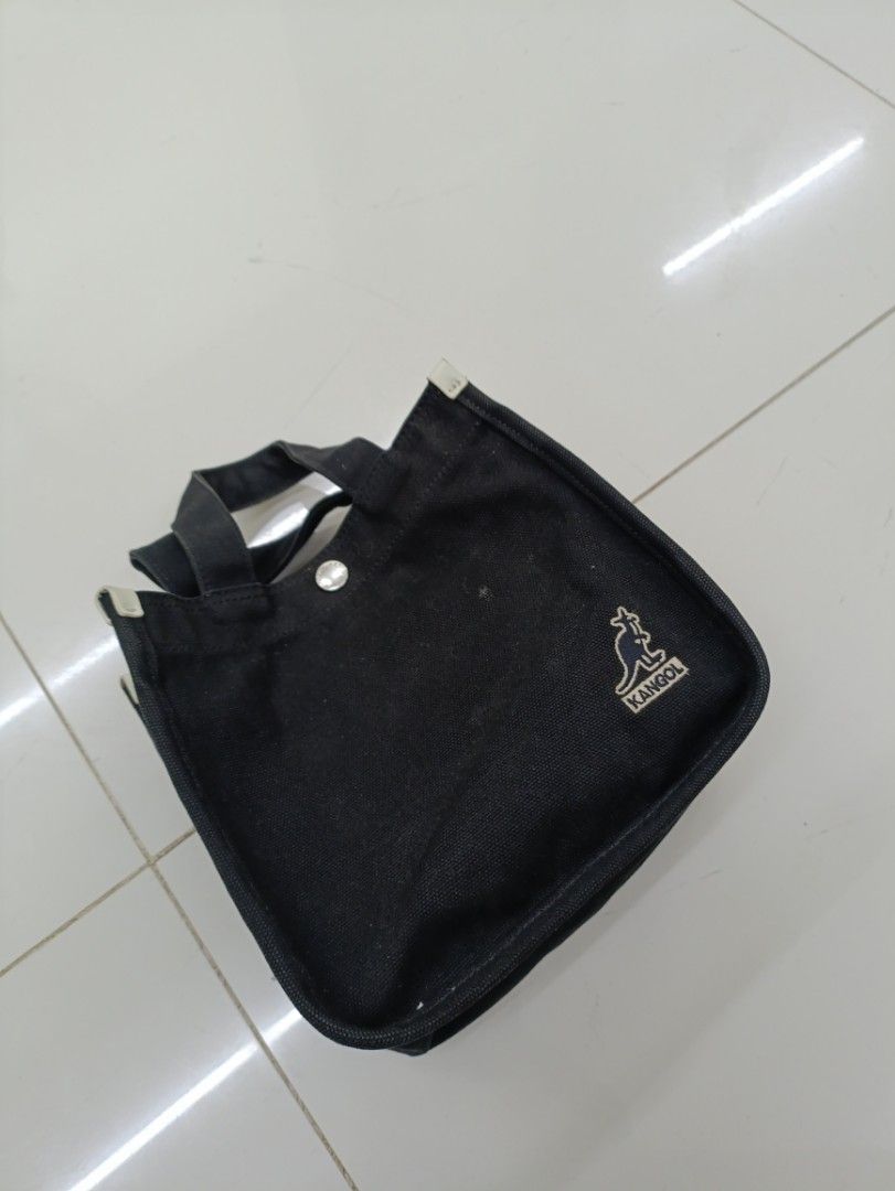 Kangol Black Canvas Tote Bag with Strap (Category: Sling Bags) located in Quezon City. Submitted by daniel_thrift05 (Listing ID 1441265702, Image 2). Description: - Brand: Kangol - Color: Black - Material: 100% Cotton Canvas - Features: Top handles, detachable shoulder strap, front zip pocket, main compartment - Design: Embroidered Kangol logo on front - Size: OS (One Size).