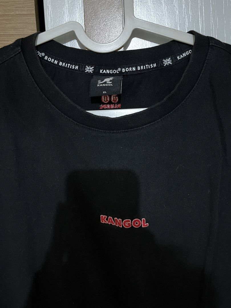 Kangol Black T-Shirt XL (Category: Tshirts & Polo Shirts ) located in Manila. Submitted by shopthevintage (Listing ID 1441346741, Image 2). Description: - Black Kangol T-shirt - Size: XL - Small red Kangol logo on the front - Red '38 Kangol' graphic on the back near the neck - Comfortable for everyday wear.