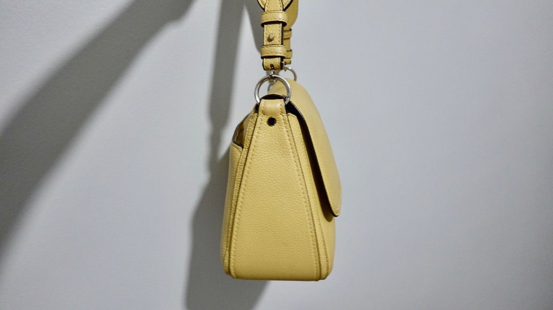 Kate Spade Yellow Leather Shoulder Bag (Category: Shoulder Bags) located in Paranaque City. Submitted by katl0 (Listing ID 1441238488, Image 3). Description: - Condition: Very good since it wasn’t used much. No peeling. - Calf leather shoulder bought in BGC last year - Pebble leather texture - Includes adjustable detachable strap - Comes with its original dust bag - Interior is clean without any stains (I used a bag organizer) - RFS: moving abroa