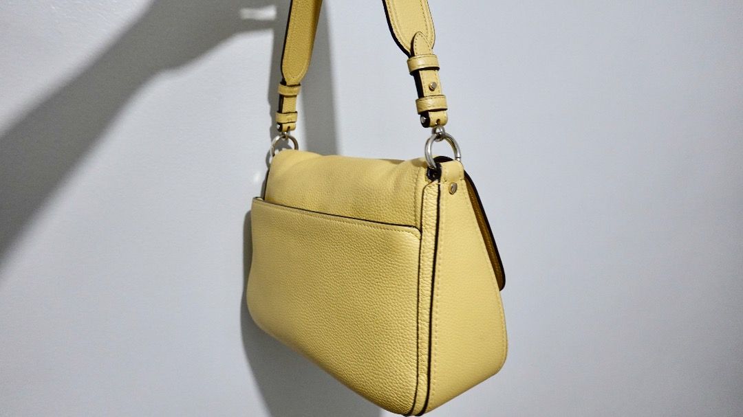 Kate Spade Yellow Leather Shoulder Bag (Category: Shoulder Bags) located in Paranaque City. Submitted by katl0 (Listing ID 1441238488, Image 2). Description: - Condition: Very good since it wasn’t used much. No peeling. - Calf leather shoulder bought in BGC last year - Pebble leather texture - Includes adjustable detachable strap - Comes with its original dust bag - Interior is clean without any stains (I used a bag organizer) - RFS: moving abroa