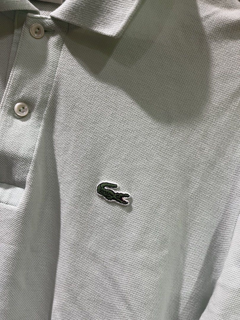 Lacoste Polo Shirt Light Blue Size 5 (Category: Tshirts & Polo Shirts ) located in Manila. Submitted by christian048 (Listing ID 1441223458, Image 2). Description: - Light blue Lacoste polo shirt - Classic design with iconic crocodile logo - Button-up collar - Tag size: 5 - Comfortable cotton material - Ideal for casual or smart-casual outfits - dimes : 21 x 29 - Authentic .