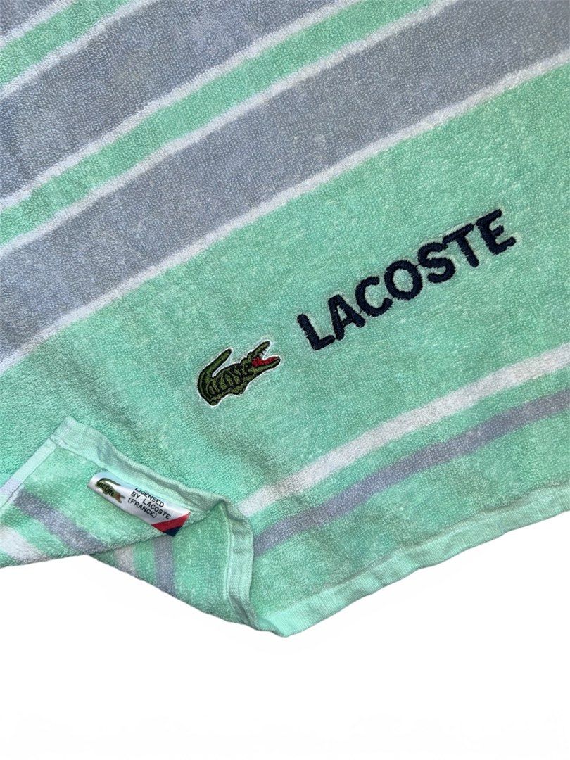 Lacoste Striped Beach Towel/Bath Towel (Category: Bedding & Towels) located in Daraga. Submitted by thrift_boi_karl (Listing ID 1441206371, Image 2). Description: Lacoste Bath Towel Width: 22 Length: 45 Excellent Condition No issue, Ready to Use..