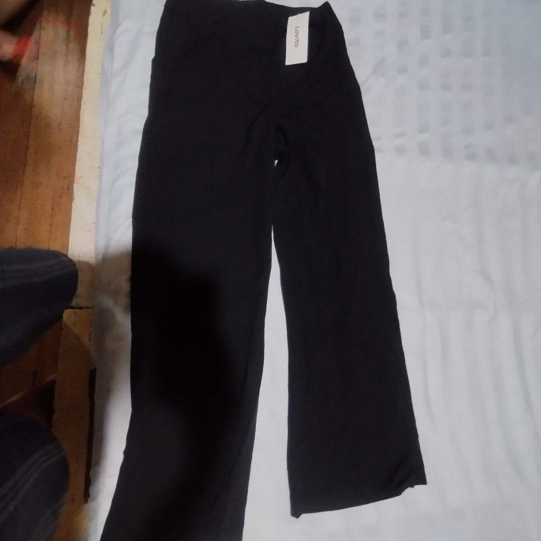 Lovito Black Wide Leg Pants Size M (Category: Other Bottoms) located in Manila. Submitted by lene48 (Listing ID 1441212416, Image 3). Description: - Brand: Lovito - Style: Wide leg pants - Color: Black - Size: Medium (M) - Material: Comfortable and flowy - Condition: Brand new with tags attached - Versatile: Great for casual or dressed-up looks28 to 29 waist .