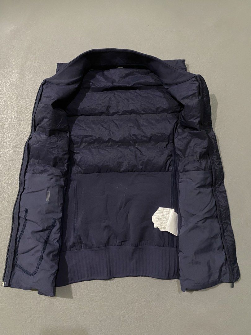 Lululemon Navy Down Vest Size 2 (Category: Vests) located in Pozorrubio. Submitted by izaykite2g (Listing ID 1441280613, Image 3). Description: - Navy blue Lululemon vest - 15 inches width - 22 inches length - excellent condition - Puffer front with stretchy side panels - Ribbed hem - Full zip closure - Two zip pockets on the inside - Ideal for layering or light warmth.