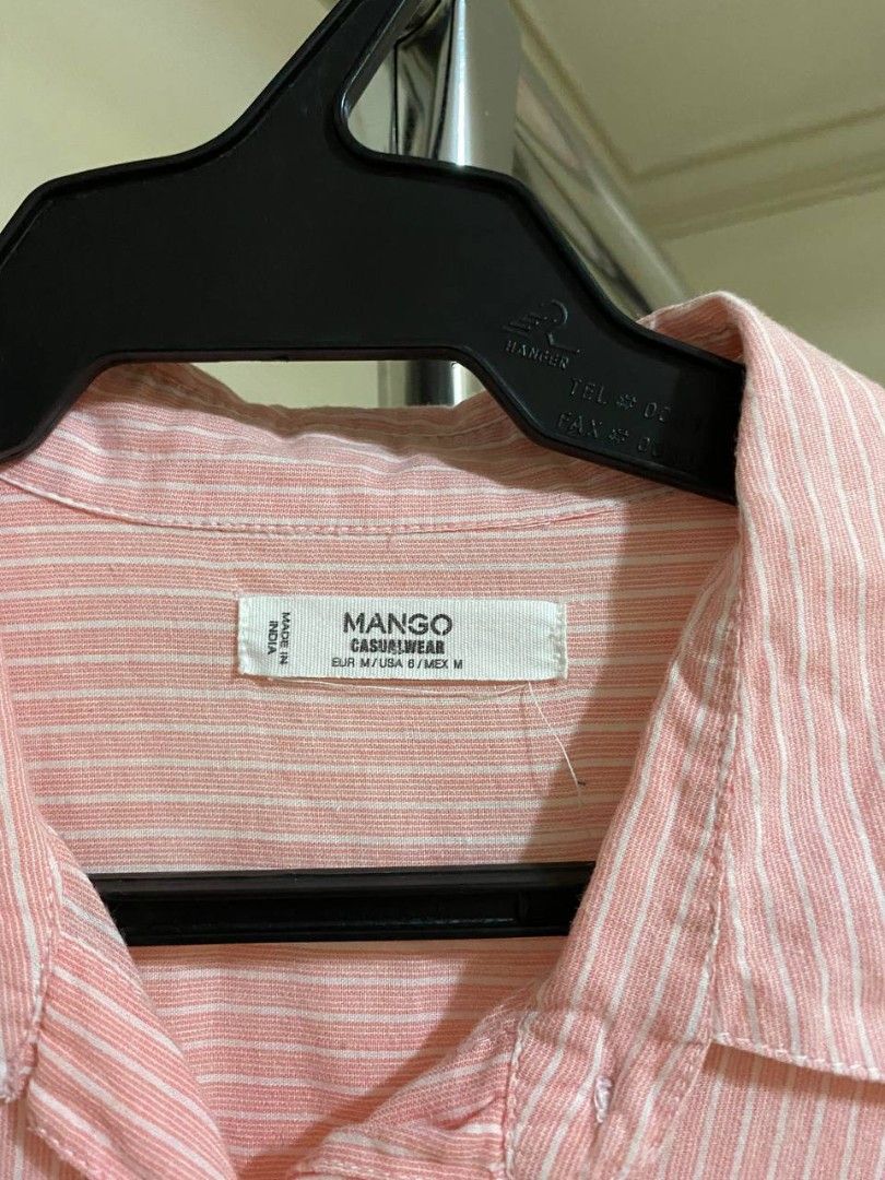 Mango Pink Striped Long Sleeve Shirt (Category: Shirts) located in Caloocan City. Submitted by beaglenose (Listing ID 1441299817, Image 2). Description: - Cute pink and white stripes - Brand: Mango - Long sleeves with button cuff details - Two chest pockets - Lightweight material, perfect for warm weather - Easy to dress up or down.