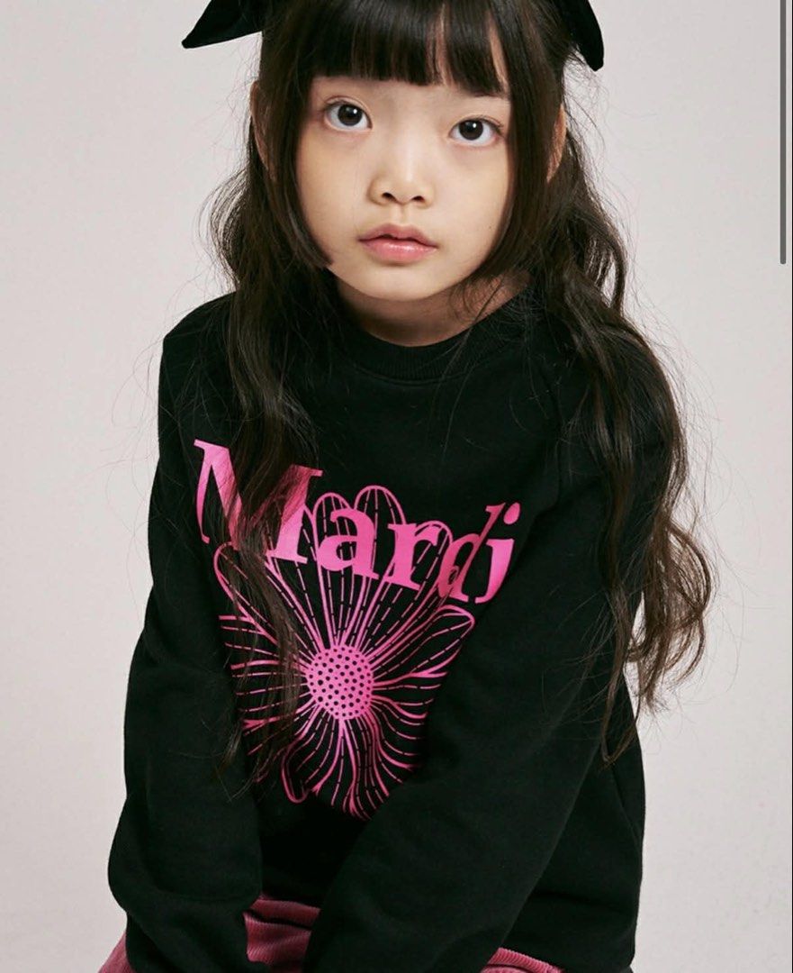 Mardi Mercredi Kid Sweatshirt (Category: Coats, Jackets and Outerwear) located in Mandaluyong City. Submitted by seanytest (Listing ID 1441365078, Image 1). Description: - Black sweatshirt with a large pink flower graphic - Features the 'Mardi' logo - Long sleeves - Ideal for casual everyday wear - Comes in its original packaging - Likely from the brand Mardi Mercredi MARDI SWEATER KIDS (Brand New) — 2000 Bought from Korea Loc: Mandaluyong.