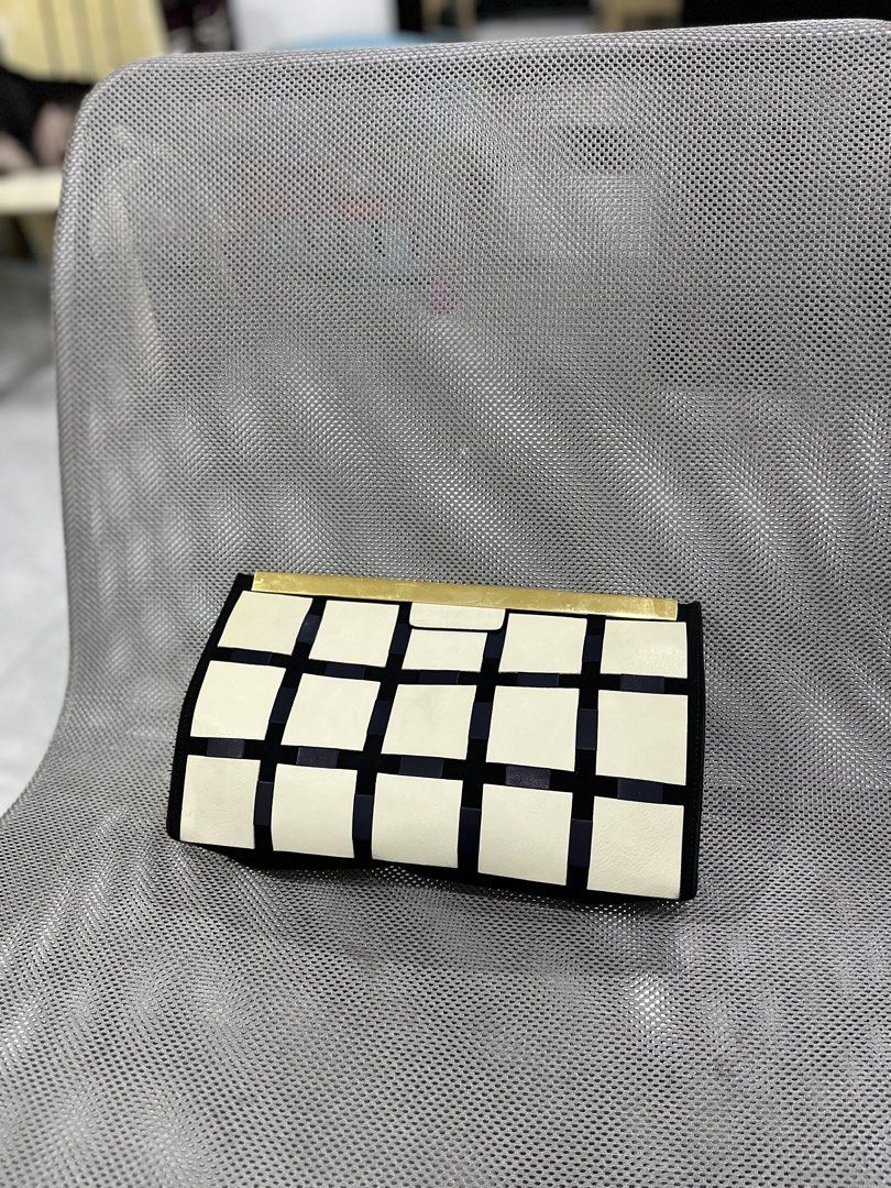 Marni - Marni Clutch Bag (Category: Luxury Bags & Wallets) located in Taguig. Submitted by shhhhselection (Listing ID 1441364389, Image 1). Description: DECLUTTERRING “Marni Clutch Bag with Gold Hardware” Authentic Good as New - Rank S Kasya Iphone 17 Pro Max and 1 Million in Cash hahaha No Issue Bag Only 2498 Pesos Only 📍Taguig City.