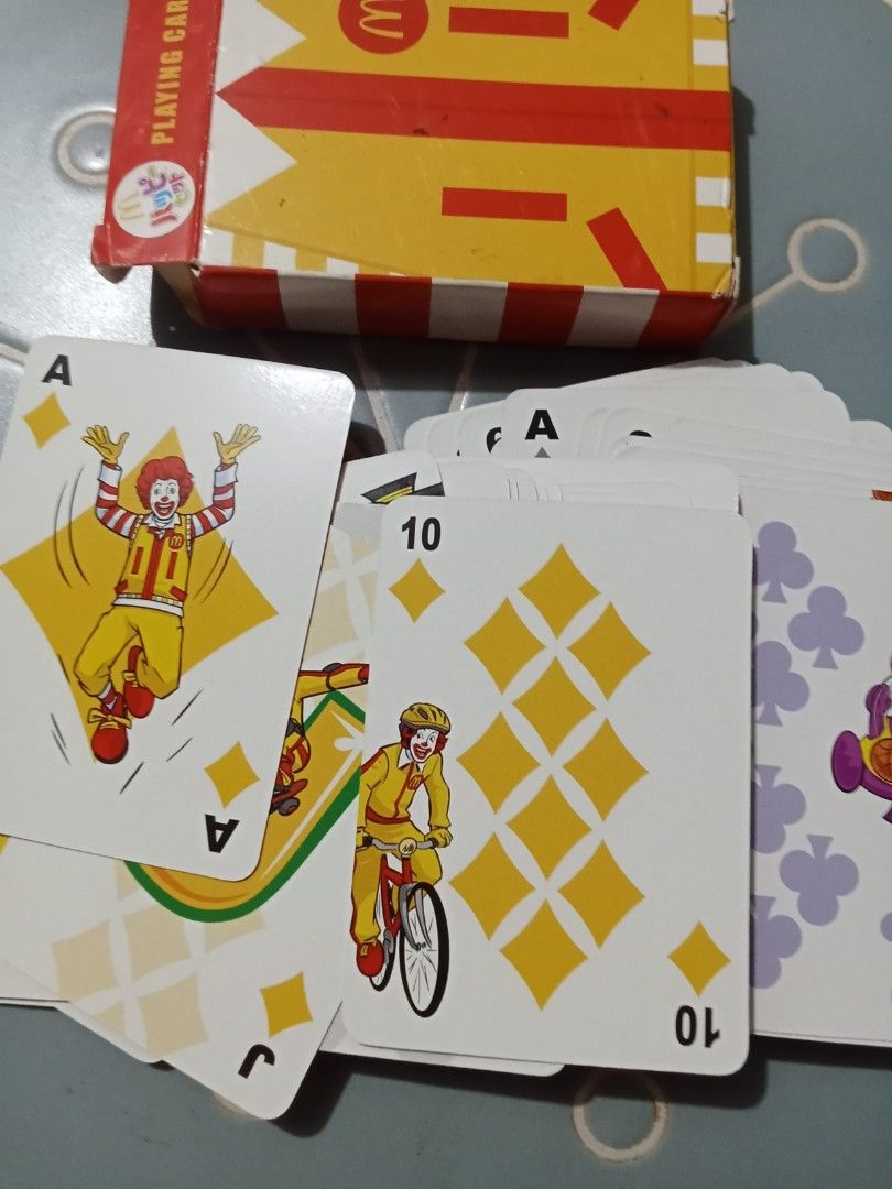 McDonald's Ronald McDonald Playing Cards (Category: Board Games & Puzzles) located in Bocaue. Submitted by marajapansurplus (Listing ID 1441286026, Image 2). Description: - McDonald's playing cards featuring Ronald McDonald and iconic characters. - Comes with the original, classic McDonald's branded box. - Ideal for collectors of McDonald's memorabilia. - Great for playing card games with a fun theme. - Unique designs showcase various McDonald's 