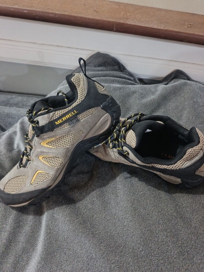Merrell Men's Hiking Shoes (Category: Sneakers) located in Manila. Submitted by cayaowilfr59065 (Listing ID 1441377114, Image 3). Description: - Merrell Men's Hiking Shoes - Color: Tan and Black - Closure: Lace-up - Features: Durable sole with excellent grip - Ideal for: Trails and outdoor adventures - Ready for your next hike!.