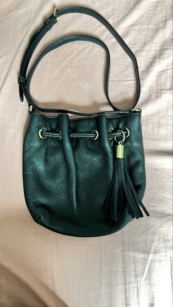 Michael Kors Black Leather Tassel Drawstring Bucket Bag (Category: Luxury Bags & Wallets) located in Cavite. Submitted by arleian (Listing ID 1441190250, Image 1). Description: - Authentic Michael Kors black leather bucket bag - Secure drawstring closure with a charming tassel detail - Elegant gold hardware accents - Adjustable strap for versatile crossbody or shoulder wear - Interior features signature MK logo lining - Ideal size for carrying yo