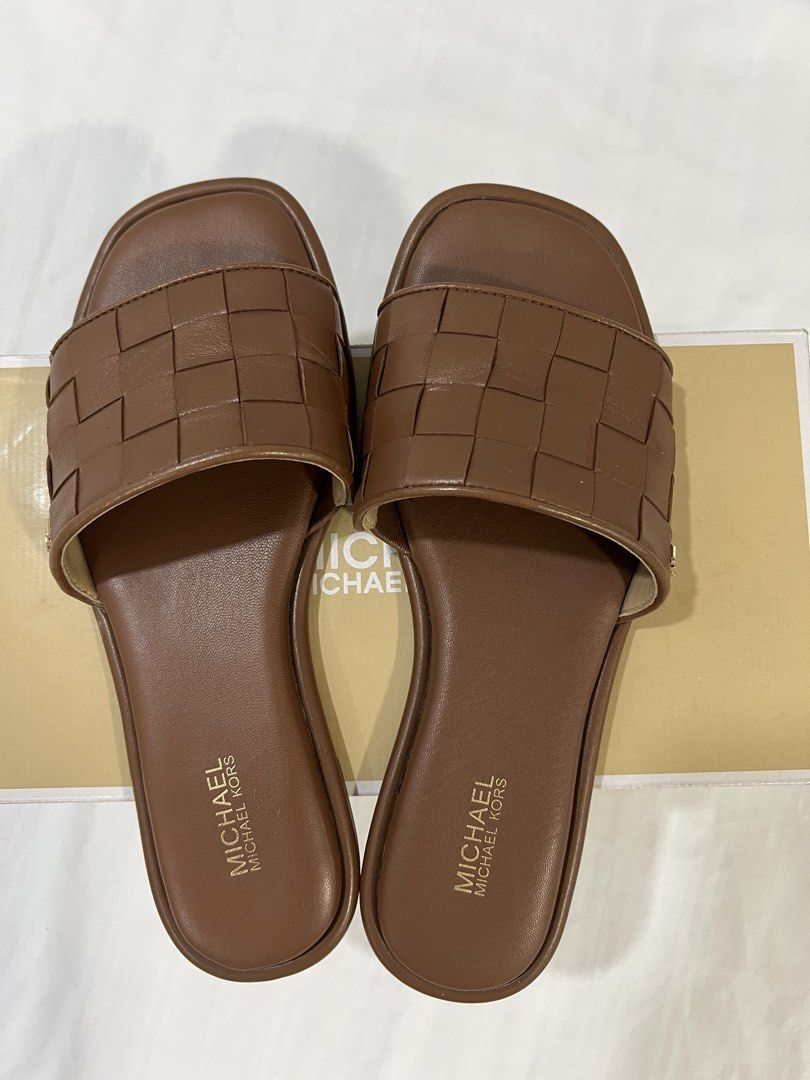 Michael Kors Brown Woven Slides Sandals (Category: Flats & Sandals) located in Pasig City. Submitted by reedcruz (Listing ID 1441345202, Image 1). Description: Michael Kors Hayworth Woven Leather Slide Sandal Size 6.5 Used twice Bought from MK Shangri-La for 8,250. .