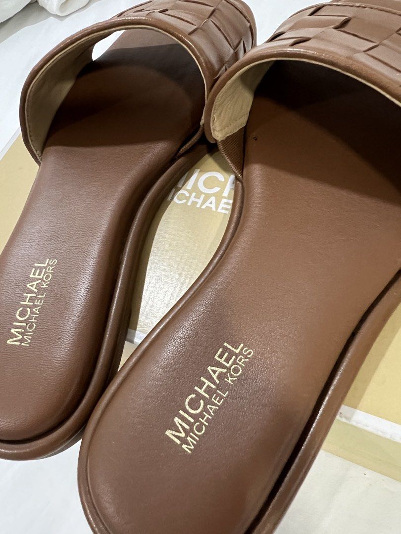 Michael Kors Brown Woven Slides Sandals (Category: Flats & Sandals) located in Pasig City. Submitted by reedcruz (Listing ID 1441345202, Image 3). Description: Michael Kors Hayworth Woven Leather Slide Sandal Size 6.5 Used twice Bought from MK Shangri-La for 8,250. .