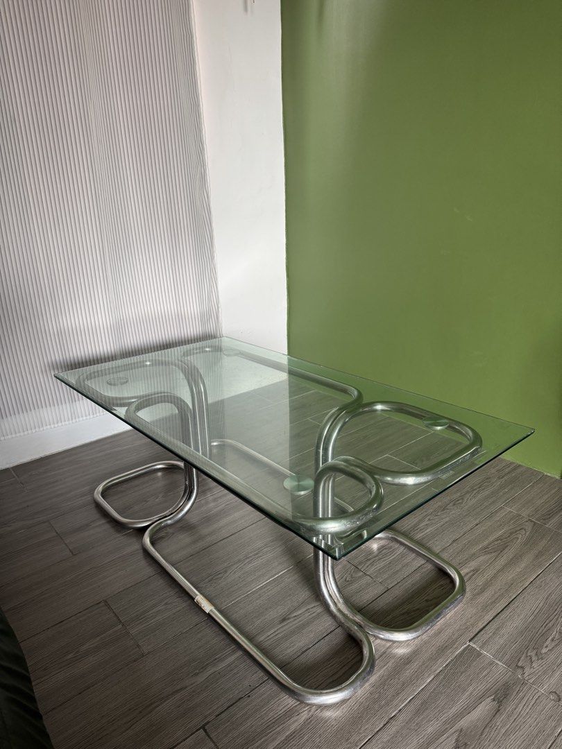 Mid Century Modern Coffee Table (Category: Tables & Sets) located in Caloocan City. Submitted by prank_ocean (Listing ID 1441195333, Image 2). Description: Bauhaus inspired coffee table with a thick glass top and chrome metal base. Solid, sturdy, and in great condition. Issue : Sign of usage as this is a vintage piece. Scratches on thick glass. Selling for ₱ 5,000.00 If you appreciate perfect imperfection, then this is for you. This is for pick u