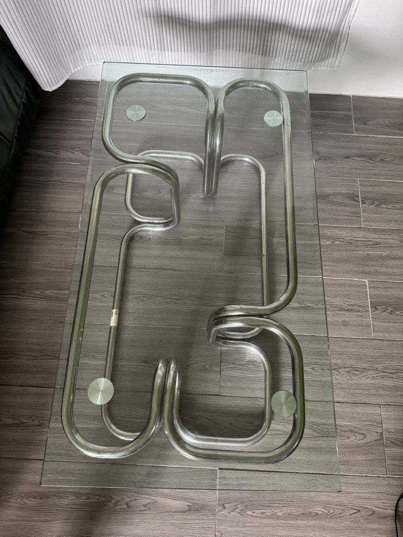 Mid Century Modern Coffee Table (Category: Tables & Sets) located in Caloocan City. Submitted by prank_ocean (Listing ID 1441195333, Image 3). Description: Bauhaus inspired coffee table with a thick glass top and chrome metal base. Solid, sturdy, and in great condition. Issue : Sign of usage as this is a vintage piece. Scratches on thick glass. Selling for ₱ 5,000.00 If you appreciate perfect imperfection, then this is for you. This is for pick u