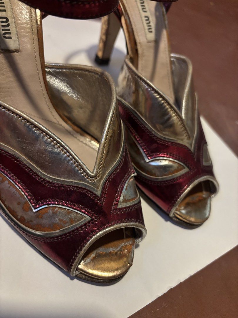 Miu Miu Metallic Peep-Toe Heels (Category: Heels) located in Manila. Submitted by danidanidani213 (Listing ID 1441264188, Image 3). Description: - Miu Miu heels - Metallic finish in gold and deep red - Peep-toe design - Ankle strap - Unique statement piece - Size 37.