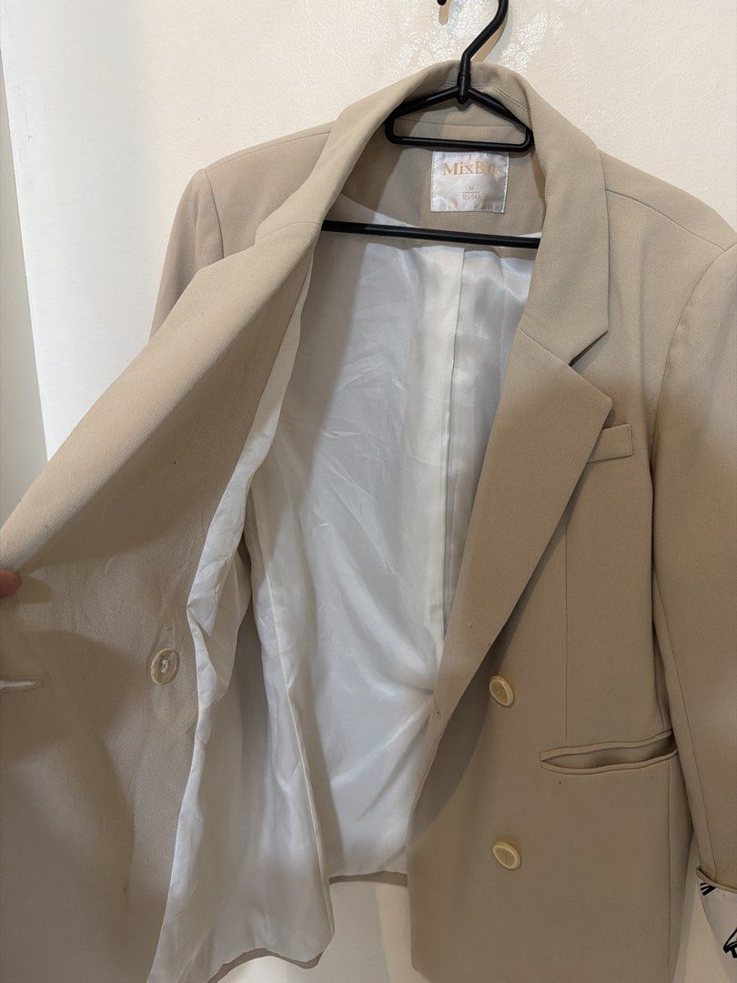 MIXBEIGE Double-breasted Beige Blazer with Printed Cuffs (Category: Coats, Jackets and Outerwear) located in Pasig City. Submitted by xxxclaire (Listing ID 1441246025, Image 3). Description: - Beige double-breasted blazer - Size M - Unique printed lining on cuffs - Two front buttons - Perfect for casual or smart outfits - Small mark on the back (refer to last photo for details).