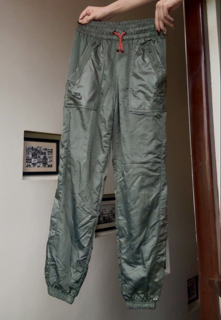 Nike Green Nylon Track Pants Joggers (Category: Joggers) located in Santa Rosa. Submitted by prelovedby.her_ (Listing ID 1441323256, Image 1). Description: Color: Green Size: XS Condition: No visible flaws; in great condition RFS: Decluttering 🧹 📍 Shipping from: Fairview, QC 🚚 Mode of Delivery: Lalamove | J&T 💵 Payment: GCash | Bank Transfer Feel free to message for any questions! 🤍.