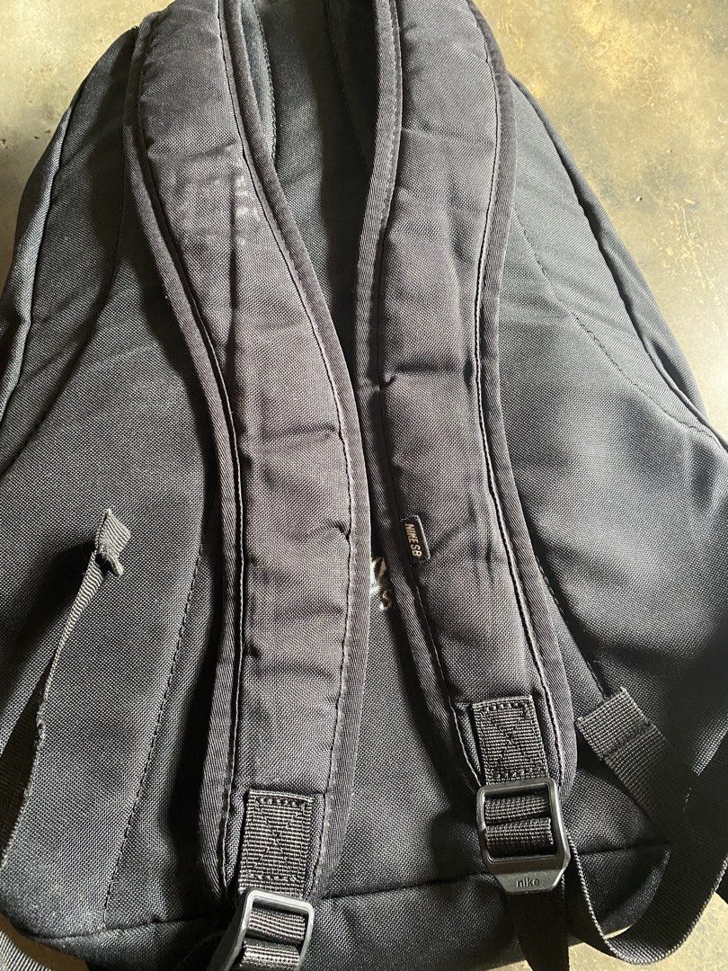 Nike SB Black Backpack (Category: Backpacks) located in Manila. Submitted by lovedeclutterph (Listing ID 1441195907, Image 2). Description: - Black Nike SB backpack - Features front straps, ideal for carrying a skateboard - Multiple pockets and compartments for organized storage - Adjustable shoulder straps for a comfortable fit - Made with durable material for long-lasting use - Perfect for everyday use or carrying your sports gear.