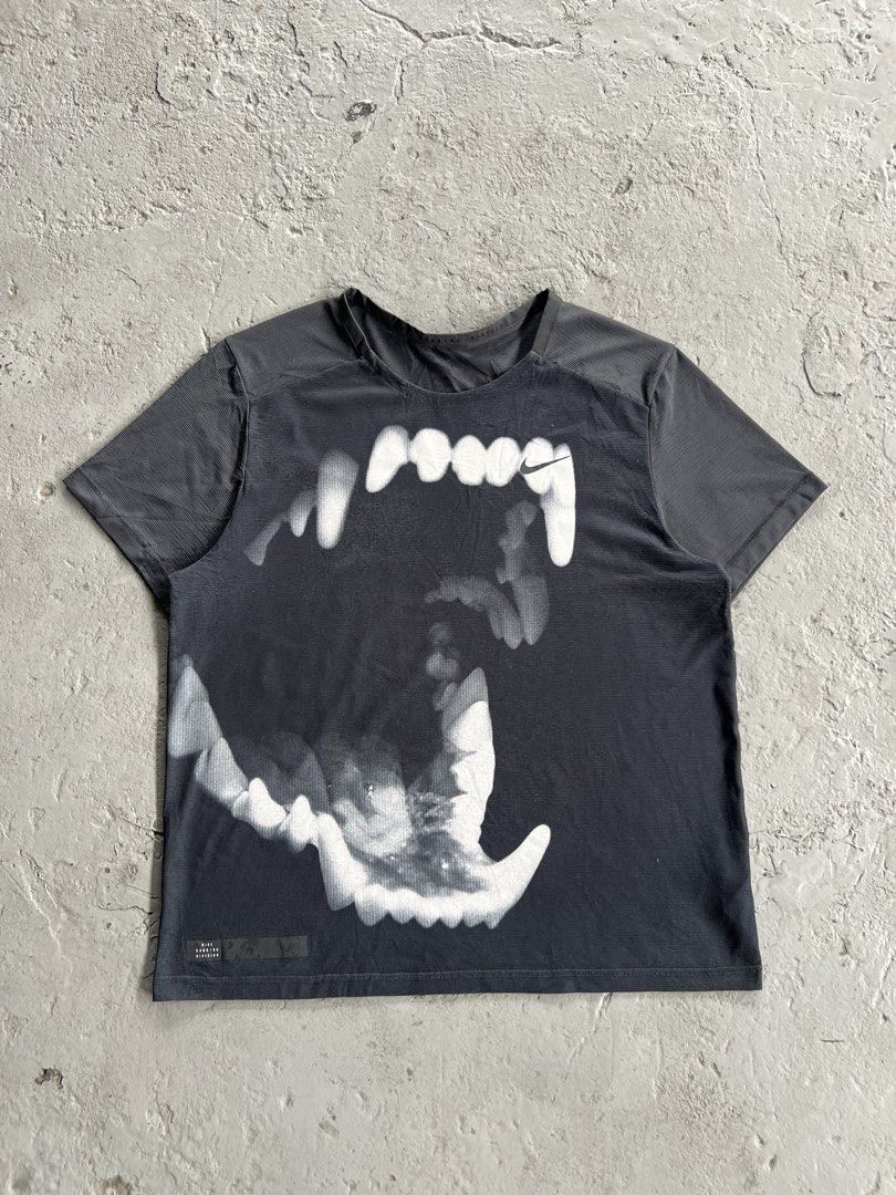 NikeADV Running Division Graphic T-Shirt (Category: Tshirts & Polo Shirts ) located in Mabalacat. Submitted by sweatout.ph2025 (Listing ID 1441219340, Image 1). Description: Dimes: 28x22 - Grey Nike t-shirt - Cool graphic print on front - Features Nike Running Division logo - Short sleeves, crew neck - Made with performance fabric - Ideal for workouts or casual wear - Please check photos for condition details.