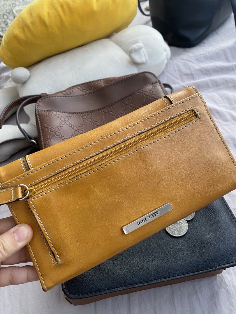 Nine West Yellow Leather Long Wallet (Category: Wallets & Card holders) located in Manila. Submitted by mpt99876 (Listing ID 1441238796, Image 3). Description: - Genuine yellow Nine West leather wallet - Secure snap closure - Ample card slots for organization - Clear ID window for easy access - Minor marks on interior lining, does not affect functionality.