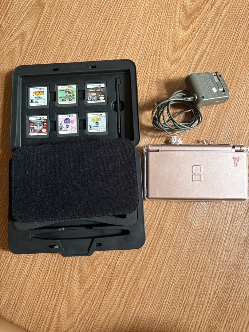 NINTENDO DS ROSE GOLD (Category: Nintendo) located in Quezon City. Submitted by killed_it026 (Listing ID 1441324514, Image 2). Description: Nintendo ds rose gold with games, original charger 110v, and acrylic case ready to use! Touch screen good Negotiable.