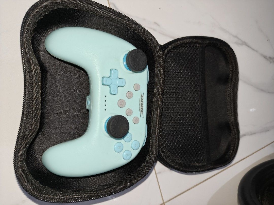 Nintendo Switch OLED Carrying Cases and Controller Accessories (Category: Nintendo) located in Manila. Submitted by olxph_nebri905 (Listing ID 1441268885, Image 2). Description: - Nintendo Switch OLED Carrying Case (White) - Light Blue Controller with Black Carrying Case - Black Grip Accessory for Joy-Cons - Separate Carrying Case with Splatoon-Themed Art - Various Cables Included - Charging Grip Included - All items compatible with Nintendo Swit