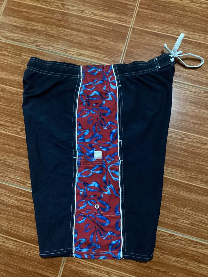 Ocean Pacific sports tag (Category: Swim Trunks & Board Shorts) located in Mangaldan. Submitted by manuelingalla_3rd (Listing ID 1441283810, Image 1). Description: - Navy blue swim trunks - Red and blue floral pattern on sides - Elastic waistband with drawstring - Oakley logo on back pocket - Suitable for swimming and lounging -Dimes: 34-40/21/12.