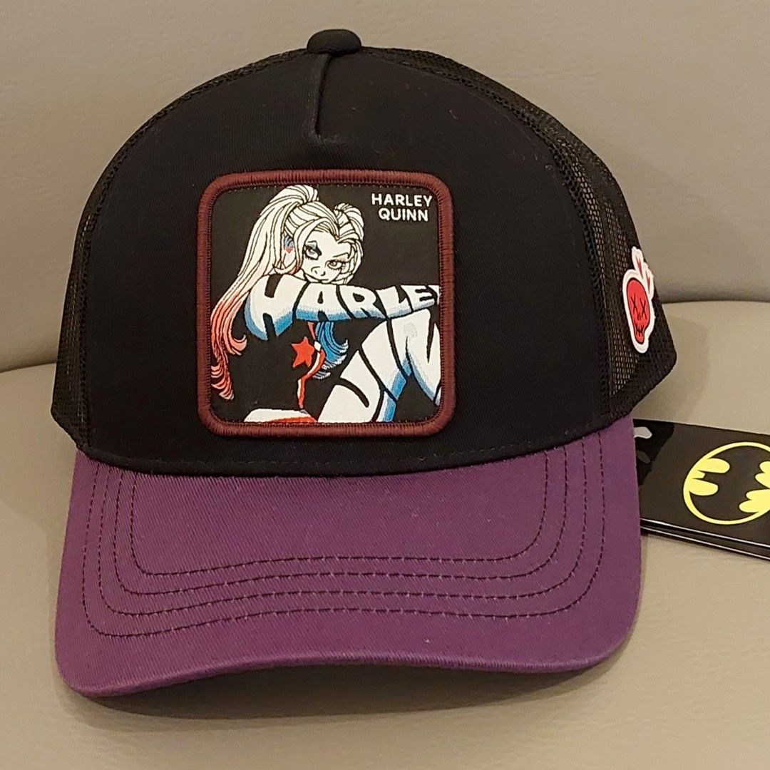Official DC Harley Quinn Trucker Cap (Category: Caps & Hats) located in Makati City. Submitted by geesharma_08 (Listing ID 1441315393, Image 1). Description: BNWT! DC/Warner Bro's merch exclusively made for Japan 🇯🇵 Hard-to-find #HarleyQuinn trucker cap with skull detail on the side. Fits all with adjustable snapback strap. Pick-up or Shipping Fee c/o Buyer.