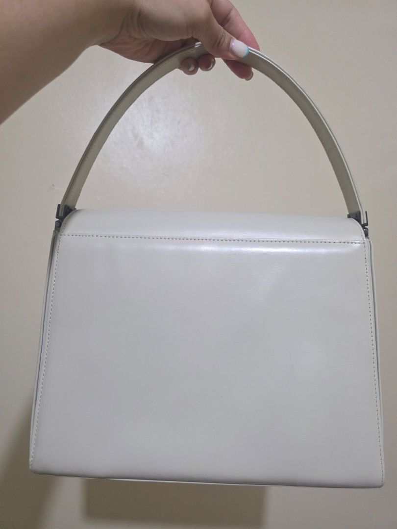 Paco Rabanne Ivory Leather Handbag (Category: Luxury Bags & Wallets) located in Las Pinas. Submitted by andthelike (Listing ID 1441287031, Image 2). Description: - Authentic Paco Rabanne ivory leather handbag - Secure silver clasp closure - Interior compartment for easy organization - Single top handle for comfortable carrying - Chic, minimalist design suitable for everyday or special events.