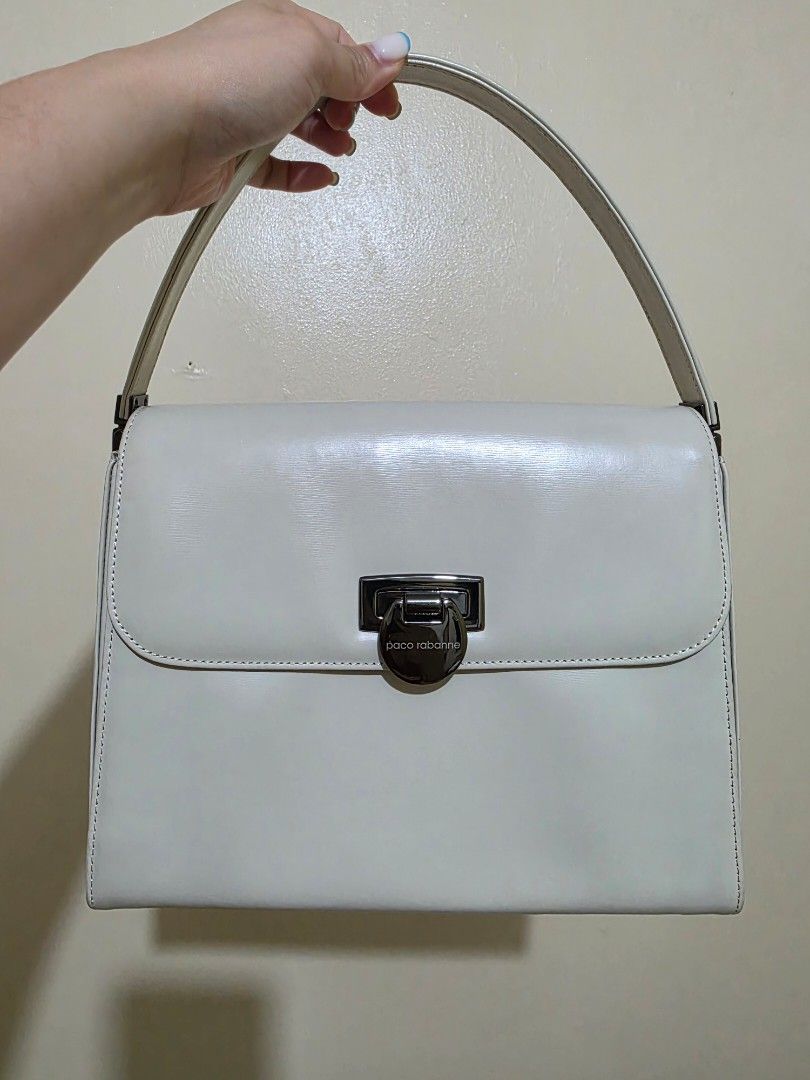 Paco Rabanne Ivory Leather Handbag (Category: Luxury Bags & Wallets) located in Las Pinas. Submitted by andthelike (Listing ID 1441287031, Image 1). Description: - Authentic Paco Rabanne ivory leather handbag - Secure silver clasp closure - Interior compartment for easy organization - Single top handle for comfortable carrying - Chic, minimalist design suitable for everyday or special events.