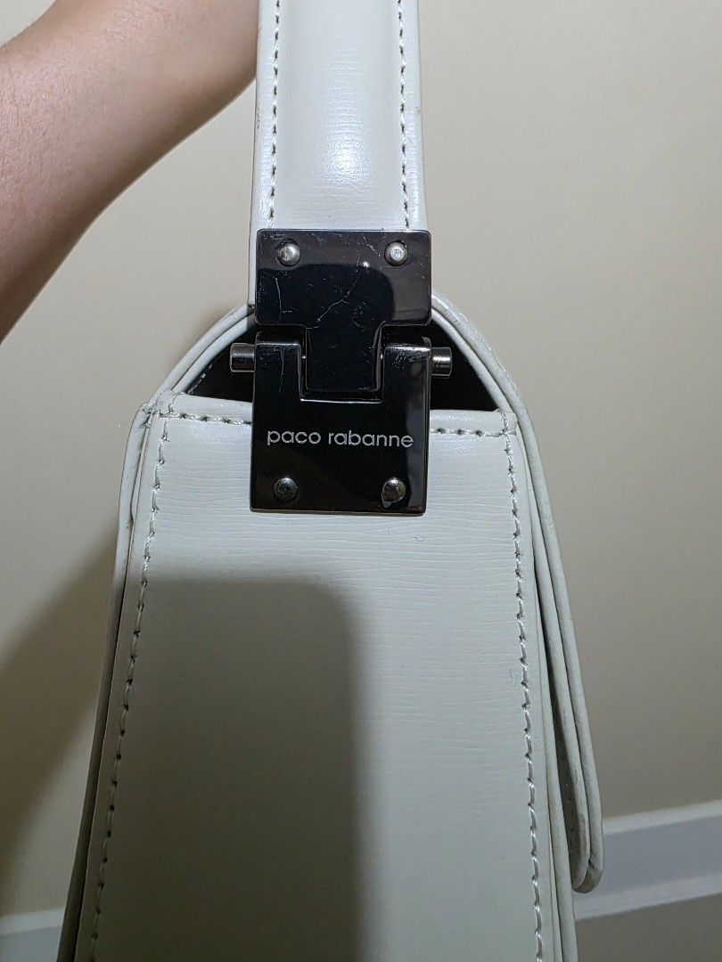Paco Rabanne Ivory Leather Handbag (Category: Luxury Bags & Wallets) located in Las Pinas. Submitted by andthelike (Listing ID 1441287031, Image 3). Description: - Authentic Paco Rabanne ivory leather handbag - Secure silver clasp closure - Interior compartment for easy organization - Single top handle for comfortable carrying - Chic, minimalist design suitable for everyday or special events.