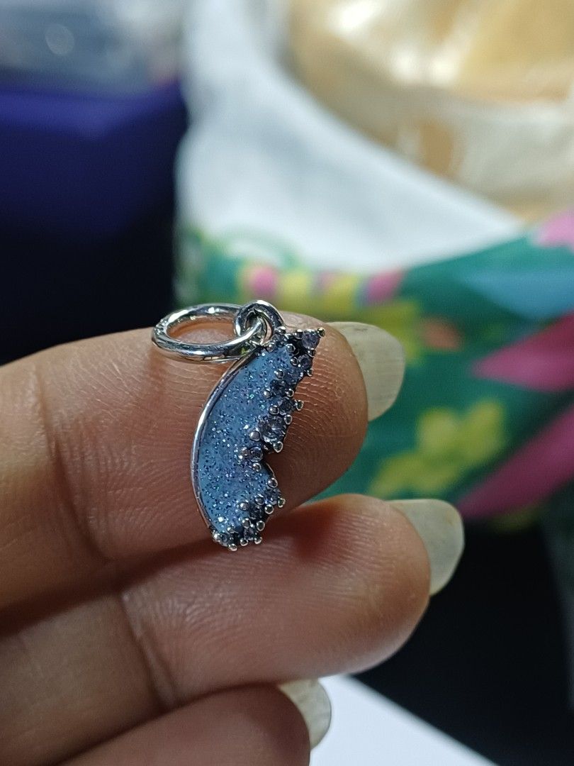 Pandora Sparkling Blue Butterfly Wing Charm (Category: Bracelets) located in Manila. Submitted by buenaventura.922 (Listing ID 1441287989, Image 2). Description: - Sparkling blue butterfly wing charm - Adorned with cubic zirconia stones - Perfect for Pandora bracelets - Adds a touch of magic - Ideal for gifting or personal treat.