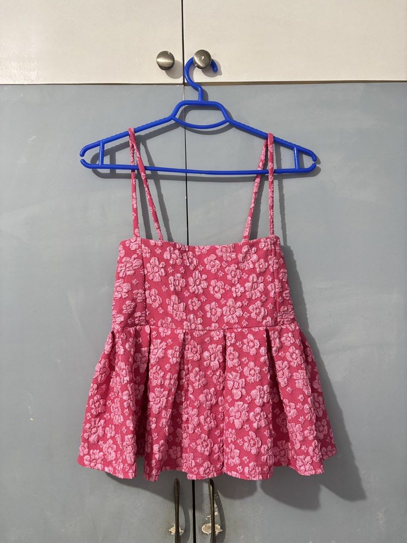Pink Floral Embossed Top (Category: Sleeveless) located in Las Pinas. Submitted by by.andreaa (Listing ID 1441181715, Image 1). Description: - Adorable pink camisole top - Flared hem with stylish pleats - Estimated size: Regular Size from TikTok shop but can fit up to XL frame - Worn twice only Photo as is. No when worn..