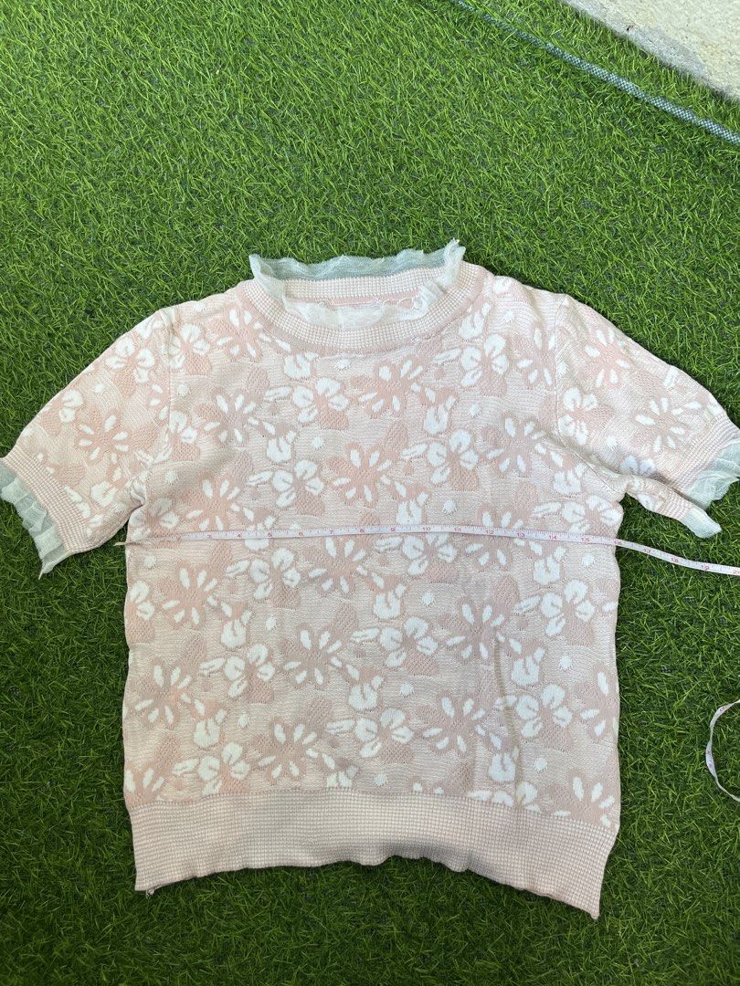 Pink Floral Knit Top with Ruffle Collar (Category: Blouses) located in Bacolod City. Submitted by marbiii (Listing ID 1441242739, Image 1). Description: - Adorable pink knit top - Features a charming white floral pattern - Short sleeves with a delicate ruffled hem - Sweet ruffled collar detail - Perfect for casual outings - Chest measurement: approximately 15 inches *fits med to semilarge.
