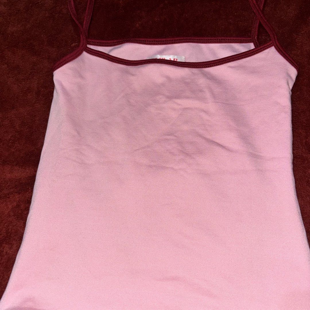 Pink Spaghetti Strap Tank Top with Maroon Trim (Category: Sleeveless) located in San Juan City. Submitted by helpabaddietodecclutter (Listing ID 1441326405, Image 2). Description: - Cute pink tank top - Spaghetti straps - Maroon trim on neckline and hem - Soft, comfortable material - Perfect for layering or wearing solo - Great fit.