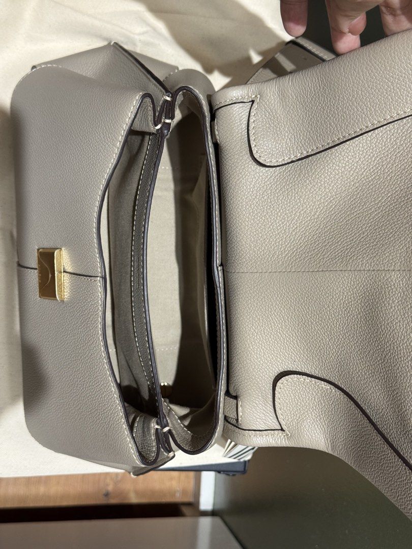 Polène Mokii Textured Taupe (Category: Luxury Bags & Wallets) located in Las Pinas. Submitted by kareenas_corner (Listing ID 1441162794, Image 3). Description: - Polène Mokki (Never used) - color may vary due to lighting. - Inclusions: Box, Dustbag, Tags are still attached - protective stickers on the enclosure - Color: Taupe - Dimensions: 24.5 x 32,5 x 11 cm - Weight: 860 g - Two interior compartments and one patch pocket - Adjustable shoulder s