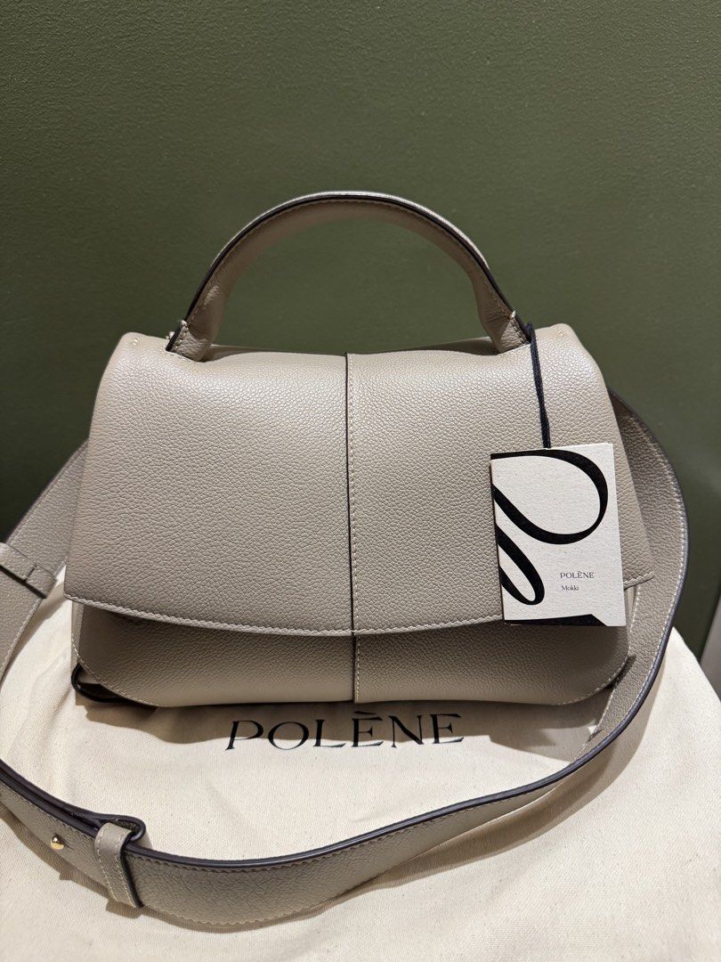 Polène Mokii Textured Taupe (Category: Luxury Bags & Wallets) located in Las Pinas. Submitted by kareenas_corner (Listing ID 1441162794, Image 1). Description: - Polène Mokki (Never used) - color may vary due to lighting. - Inclusions: Box, Dustbag, Tags are still attached - protective stickers on the enclosure - Color: Taupe - Dimensions: 24.5 x 32,5 x 11 cm - Weight: 860 g - Two interior compartments and one patch pocket - Adjustable shoulder s