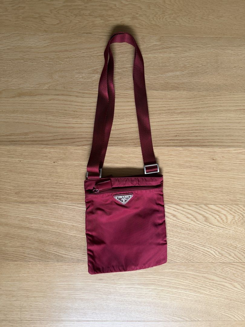 Prada Red Nylon Tessuto Crossbody Bag (Category: Luxury Bags & Wallets) located in Pasay City. Submitted by elleventh (Listing ID 1441185936, Image 1). Description: - Rank A - 8.5” x 7” IG: @elleventhph Detailed photos are provided in each listing and FINAL PRICES ARE ALREADY POSTED. All items are guaranteed authentic and are personally curated and sourced by the founder. If the item does not come with an authenticity certificate, we can provide 