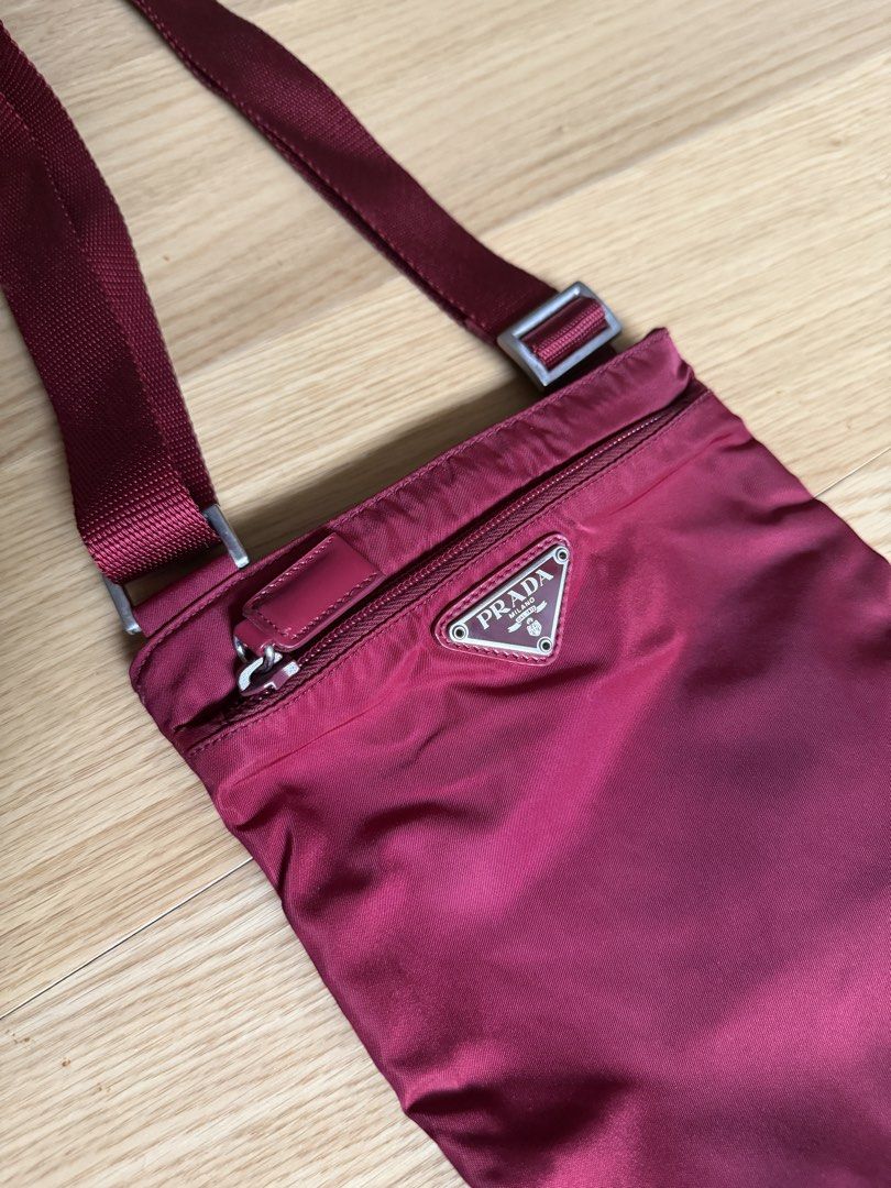 Prada Red Nylon Tessuto Crossbody Bag (Category: Luxury Bags & Wallets) located in Pasay City. Submitted by elleventh (Listing ID 1441185936, Image 2). Description: - Rank A - 8.5” x 7” IG: @elleventhph Detailed photos are provided in each listing and FINAL PRICES ARE ALREADY POSTED. All items are guaranteed authentic and are personally curated and sourced by the founder. If the item does not come with an authenticity certificate, we can provide 
