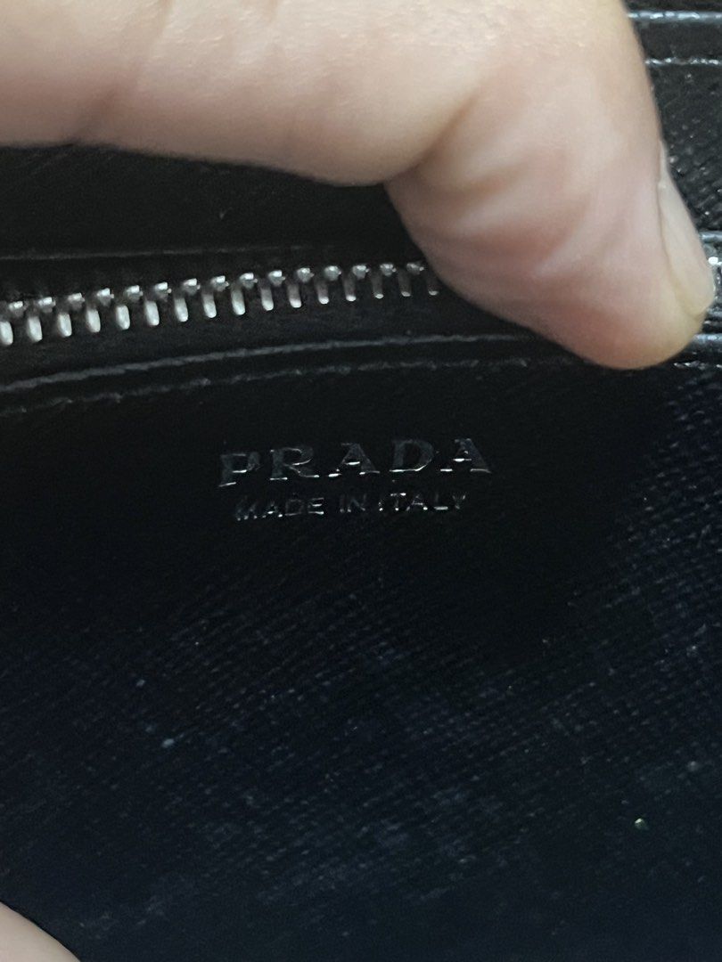 Prada Saffiano Leather Zip Around Wallet Black (Category: Luxury Bags & Wallets) located in Victorias. Submitted by lan1877 (Listing ID 1441184391, Image 3). Description: - Authentic Prada Wallet Rank SA - Black Saffiano Leather - Zip-around Closure - Multiple Card Slots & Compartments - Includes Dust Bag - Made in Italy - Ideal for organizing essentials.