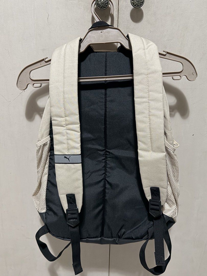 Puma Backpack Beige Black (Category: Backpacks) located in Valenzuela. Submitted by AllyG888 (Listing ID 1441319905, Image 2). Description: - Classic Puma backpack - no signs of usage almost bnew - Color: Beige with black accents - Iconic orange and black Puma logo - Side mesh pockets for water bottles or essentials - Wide-opening main compartment for easy access - Spacious interior, ideal for school or everyday carry Price still nego Rfs: declut