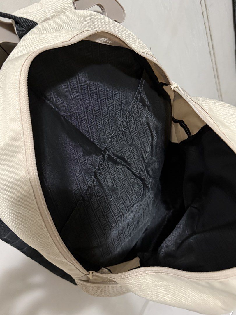 Puma Backpack Beige Black (Category: Backpacks) located in Valenzuela. Submitted by AllyG888 (Listing ID 1441319905, Image 3). Description: - Classic Puma backpack - no signs of usage almost bnew - Color: Beige with black accents - Iconic orange and black Puma logo - Side mesh pockets for water bottles or essentials - Wide-opening main compartment for easy access - Spacious interior, ideal for school or everyday carry Price still nego Rfs: declut