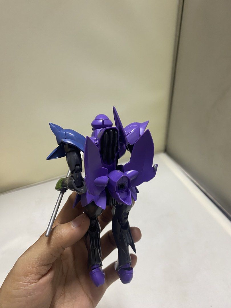Purple and Blue Mecha Robot Action Figure (Category: Toys & Games) located in Pasacao. Submitted by wengpullar37205 (Listing ID 1441338620, Image 2). Description: - Eye-catching purple and blue robot figure - Includes a cool sword accessory - Fully articulated joints for dynamic posing - Perfect for collectors and display enthusiasts.