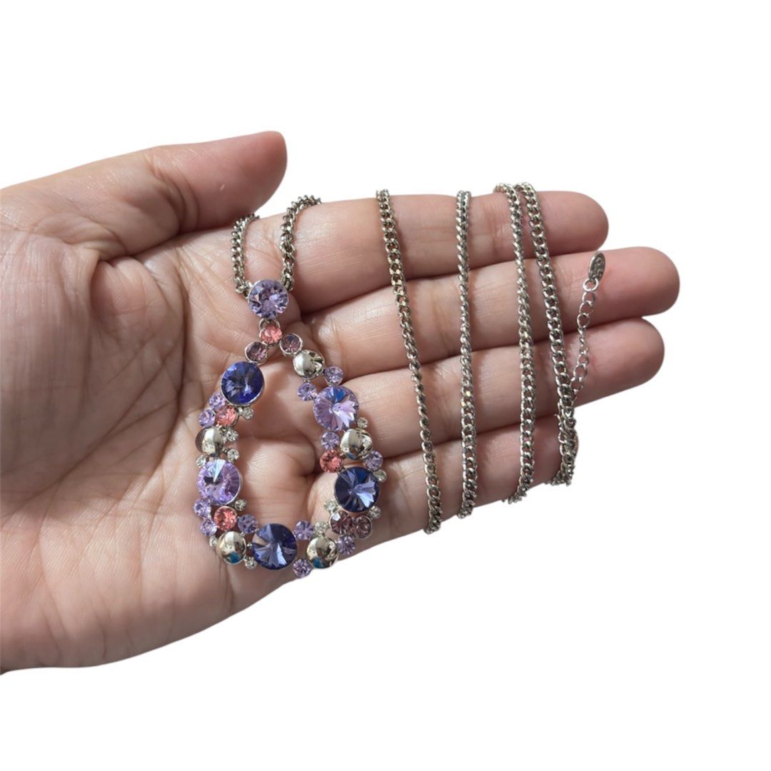 Purple crystal teardrop necklace (Category: Necklaces) located in Paranaque City. Submitted by dalle_closet (Listing ID 1441179298, Image 1). Description: Very nice Length chain: 32 inches Malaki po yung pendant nito With brand logo siya, hindi ko lang alam kung anong brand ito. .