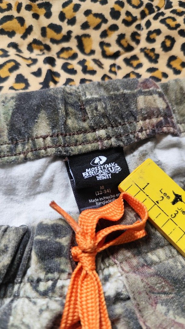 Real tree Pajama by Mossy Oak (Category: Joggers) located in Andop. Submitted by ukaylangpo (Listing ID 1441298457, Image 3). Description: SEE PHOTO FOR DIMES! EXCELLENT CONDITION - Mossy Oak camouflage fleece pants - Size: Medium - Elastic waistband with adjustable orange drawstring - Soft and comfortable for lounging - Ideal for outdoor enthusiasts or relaxing at home - Great for cooler weather.