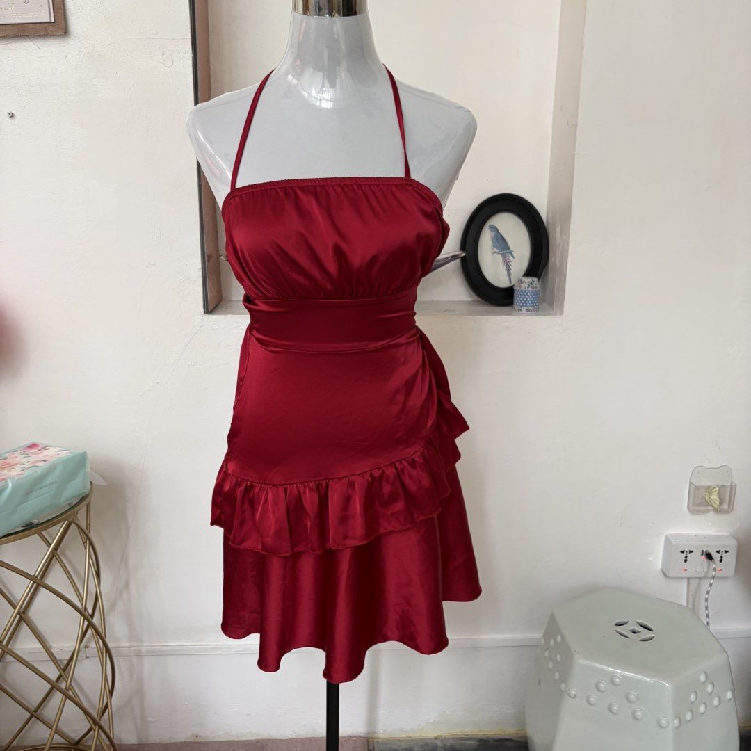 Red Satin Halter Neck Ruffle Mini Dress (Category: Dresses) located in Pasig City. Submitted by myclosettoyoursmnl (Listing ID 1441295362, Image 1). Description: - Cute red satin mini dress - Halter neck design - Smocked back for a comfortable fit - Flirty ruffle details on the skirt - Ties at the back of the neck - Ideal for parties, nights out, or special occasions.