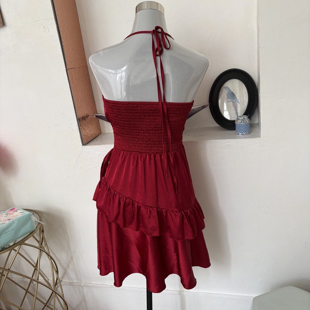 Red Satin Halter Neck Ruffle Mini Dress (Category: Dresses) located in Pasig City. Submitted by myclosettoyoursmnl (Listing ID 1441295362, Image 2). Description: - Cute red satin mini dress - Halter neck design - Smocked back for a comfortable fit - Flirty ruffle details on the skirt - Ties at the back of the neck - Ideal for parties, nights out, or special occasions.