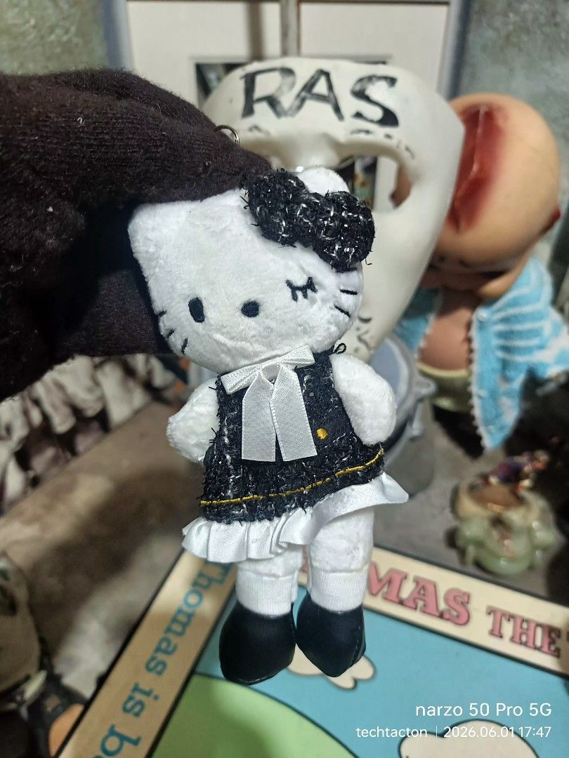 Sanrio Hello Kitty long legs charm keychain (Category: Character Goods) located in Santo Tomas. Submitted by pickers_corner (Listing ID 1441326960, Image 1). Description: Sanrio Hello Kitty long legs charm keychain featuring a black tweed dress. [1.