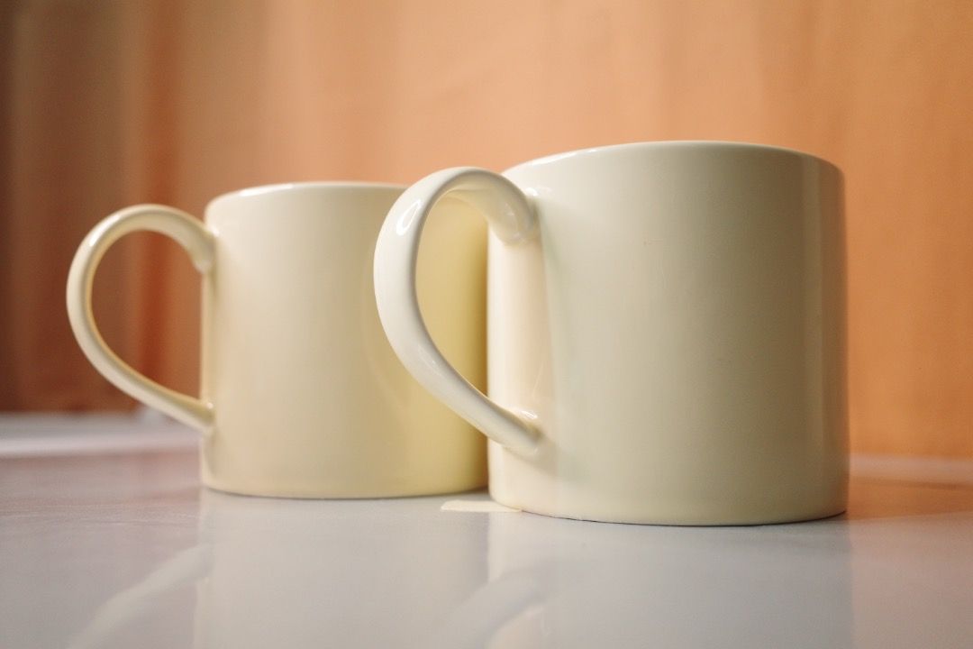 Set of 2 Cream Ceramic Mugs (Category: Coffee & Tea Tableware) located in Subic. Submitted by aranetaliz1008 (Listing ID 1441294475, Image 1). Description: - Set of two simple cream ceramic mugs. - Classic cylindrical shape with comfortable handles. - Versatile design complements any kitchen. - Durable and perfect for daily use. These are cute curated mugs, mostly IG-worthy, some are not perfectly flawless, but they’re nice as they are! 📍Olongap